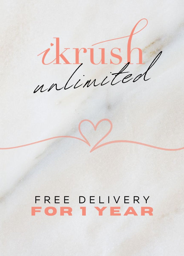 Pink text and heart on white marble surface promoting the Year Free Delivery - UK iKrush Unlimited subscription for unlimited free delivery for UK shoppers.