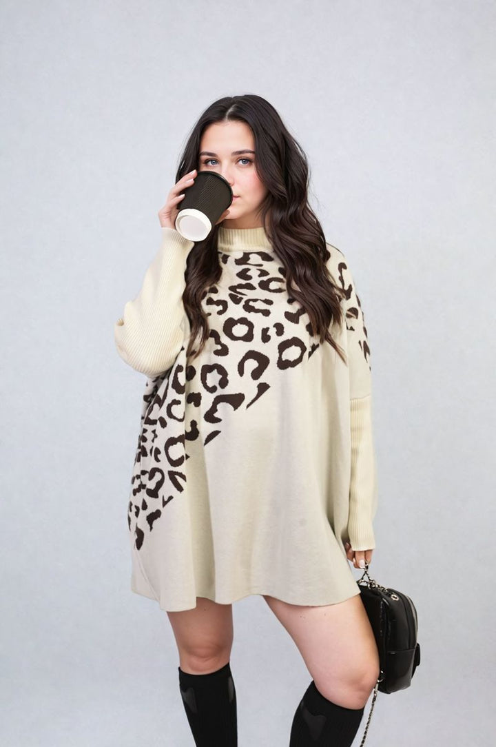 Woman holding coffee, wearing Leopard Print Knitted Long Sleeve Jumper, showcasing its trendy leopard pattern and cozy design, perfect for stylish everyday wear.