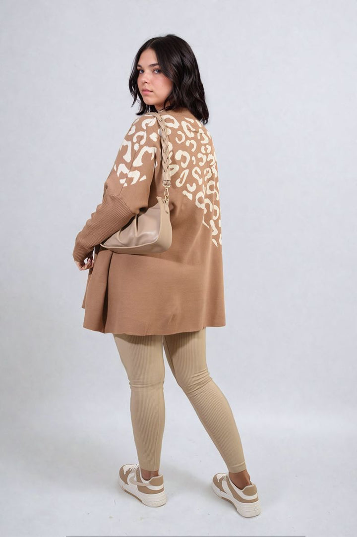 Woman models the Abigail Leopard Print Knitted Long Sleeve Jumper, showcasing its trendy design and cozy fit, perfect for stylish everyday wear.