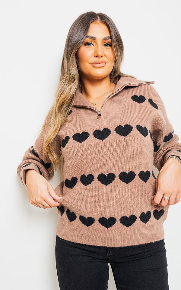 Woman wearing Heart Prints Zip High Neck Knitted Jumper featuring black heart designs, showcasing cozy knit texture and high neck style, perfect for casual or date outings.