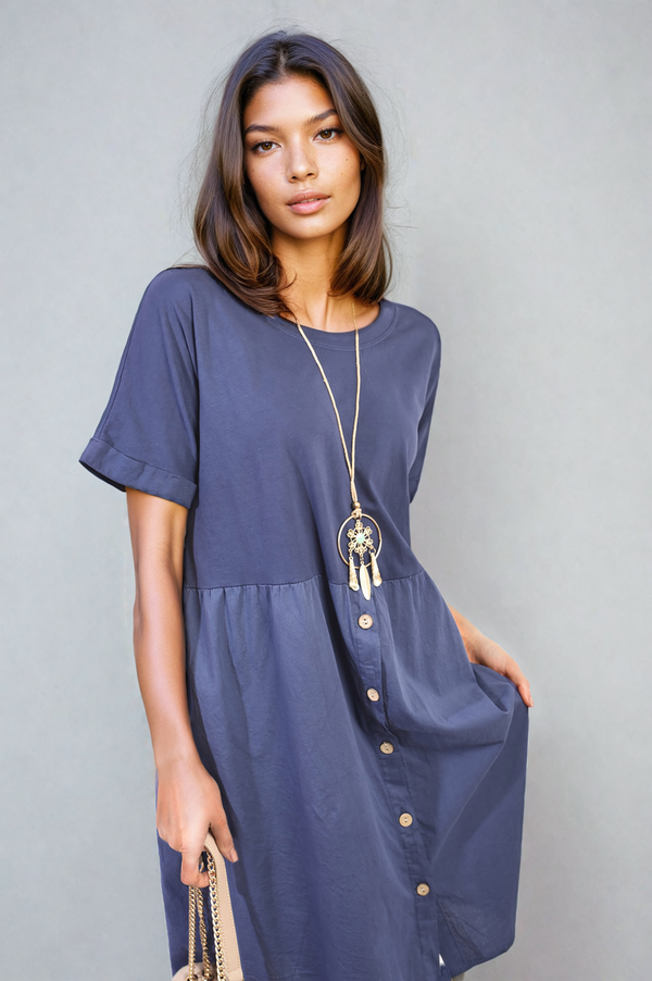 Woman wearing the Aileen Short Sleeve Button Front Midi Dress, showcasing its flowing silhouette and vintage charm with an included necklace.