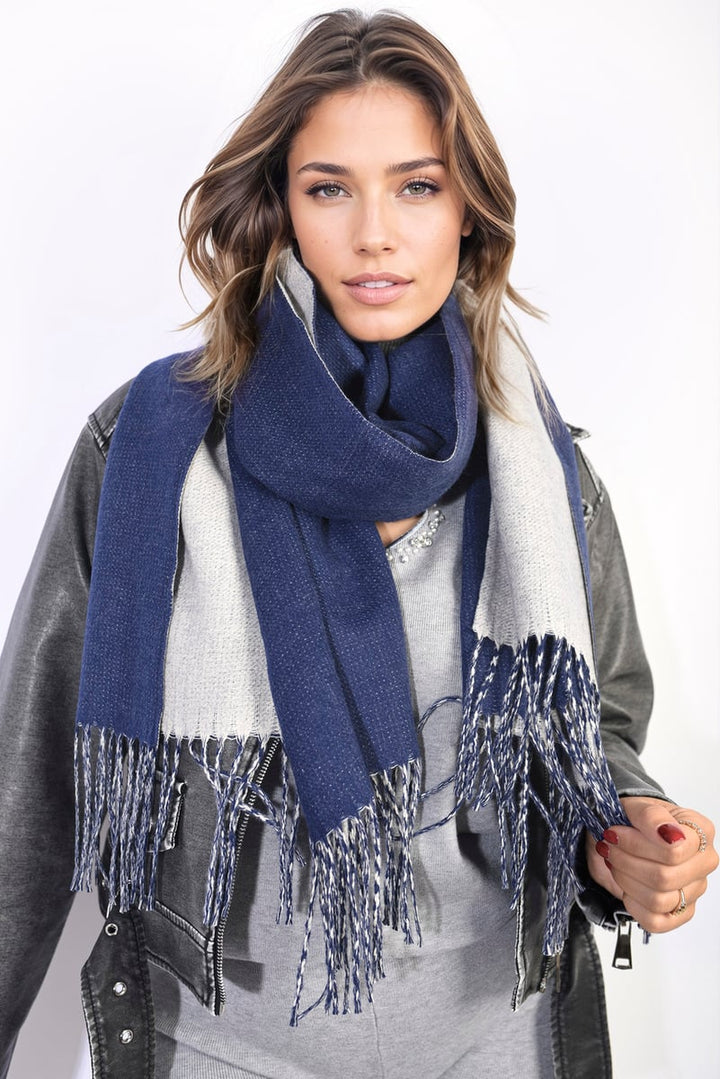 Woman wearing the Aisha Winter Oversized Scarf with Tassel, showcasing its cozy, oversized fit and chic tassel details, perfect for stylish winter warmth.