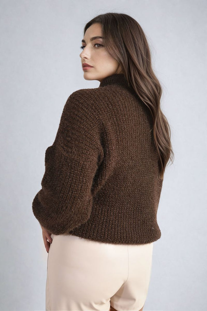 Woman wearing the Alejandra Buttons Long Sleeves Chunky Knit Top, showcasing its chunky knit texture and button details for a cozy, stylish look.