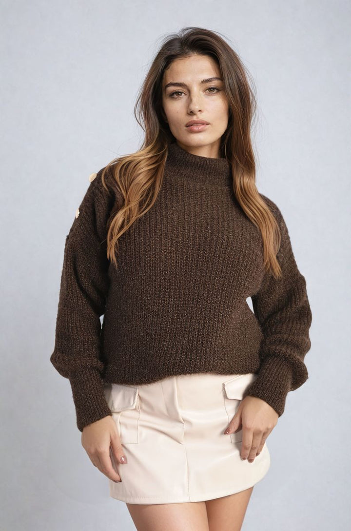 Woman in chunky knit top with button details, posing to showcase the Alejandra Buttons Long Sleeves Chunky Knit Top, ideal for cozy and stylish layering.