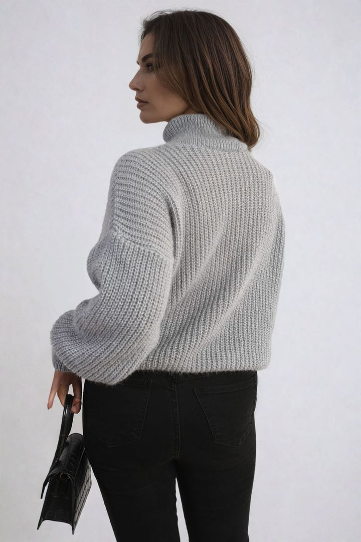 Woman wearing the Alejandra Buttons Long Sleeves Chunky Knit Top, showcasing its textured knit and button details, ideal for stylish warmth and layering.