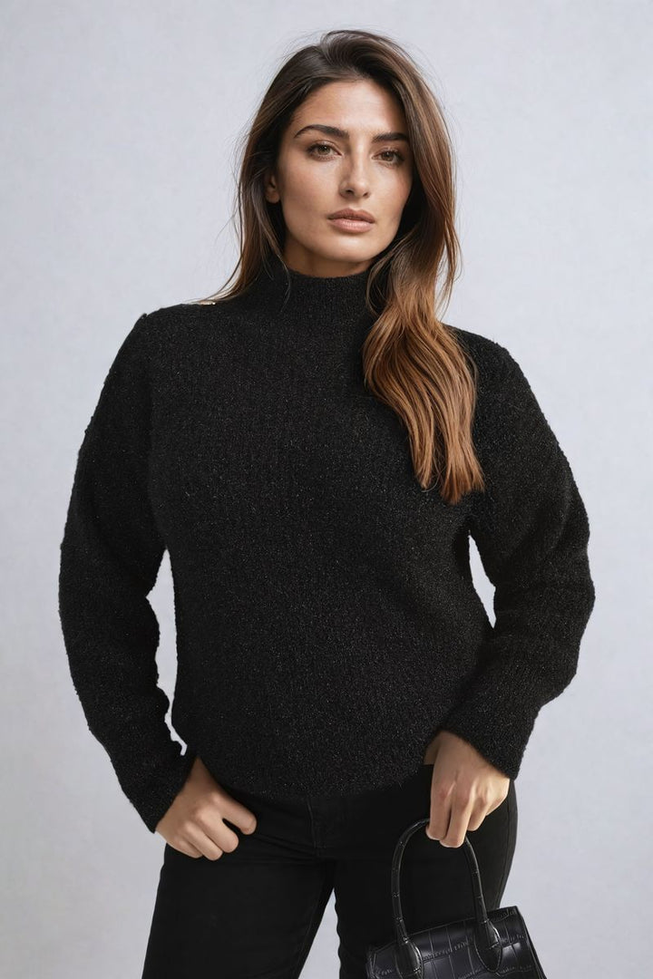 Woman wearing the Alejandra Buttons Long Sleeves Chunky Knit Top, showcasing its cozy texture and button details, ideal for trendy layering and everyday style.