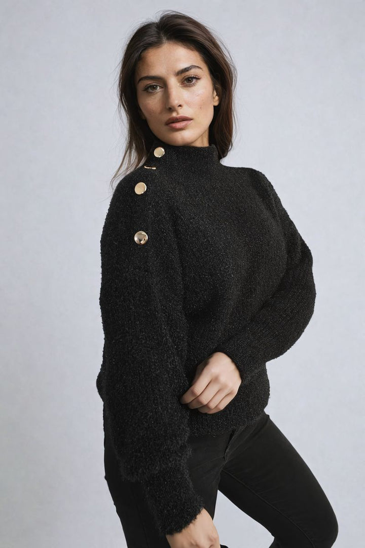 Woman wearing the Alejandra Buttons Long Sleeves Chunky Knit Top, showcasing its cozy texture and button details, perfect for stylish layering.