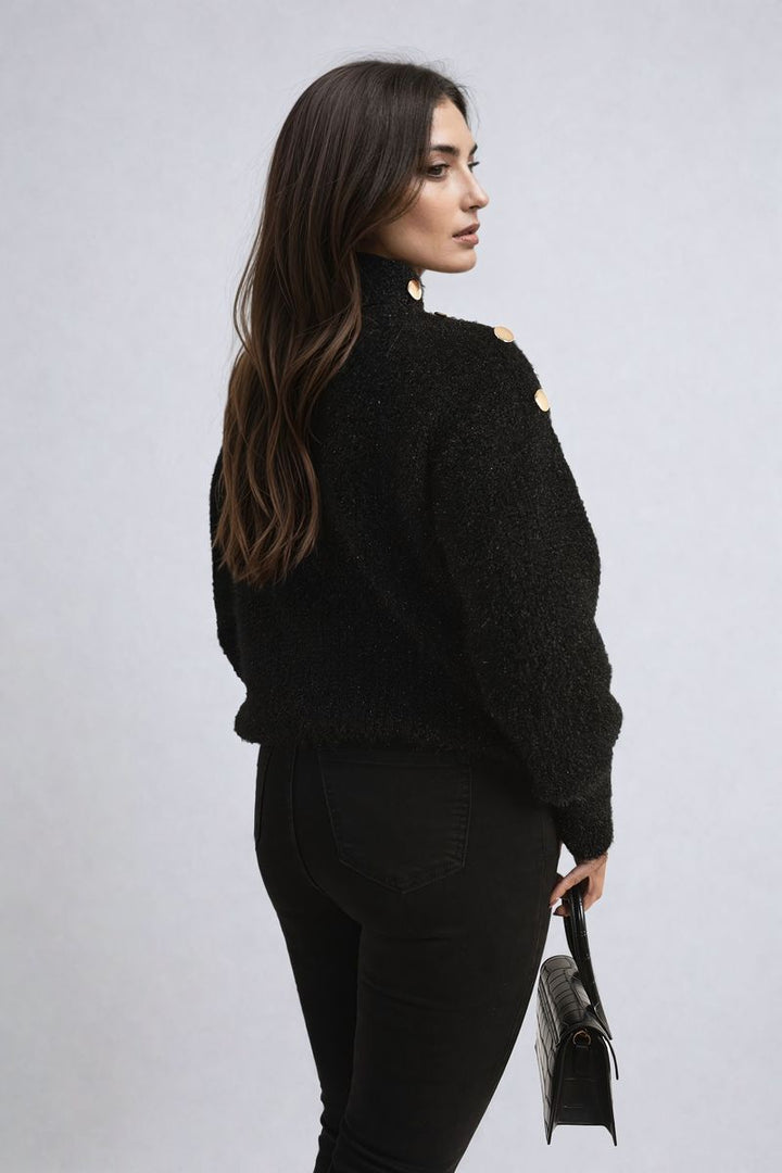 Woman wearing the Alejandra Buttons Long Sleeves Chunky Knit Top, showcasing its cozy chunky knit texture and stylish button details for a chic, layered look.