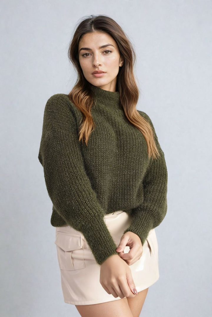 Woman wearing the Alejandra Buttons Long Sleeves Chunky Knit Top, showcasing its chunky knit texture and button details, ideal for a cozy, stylish look.