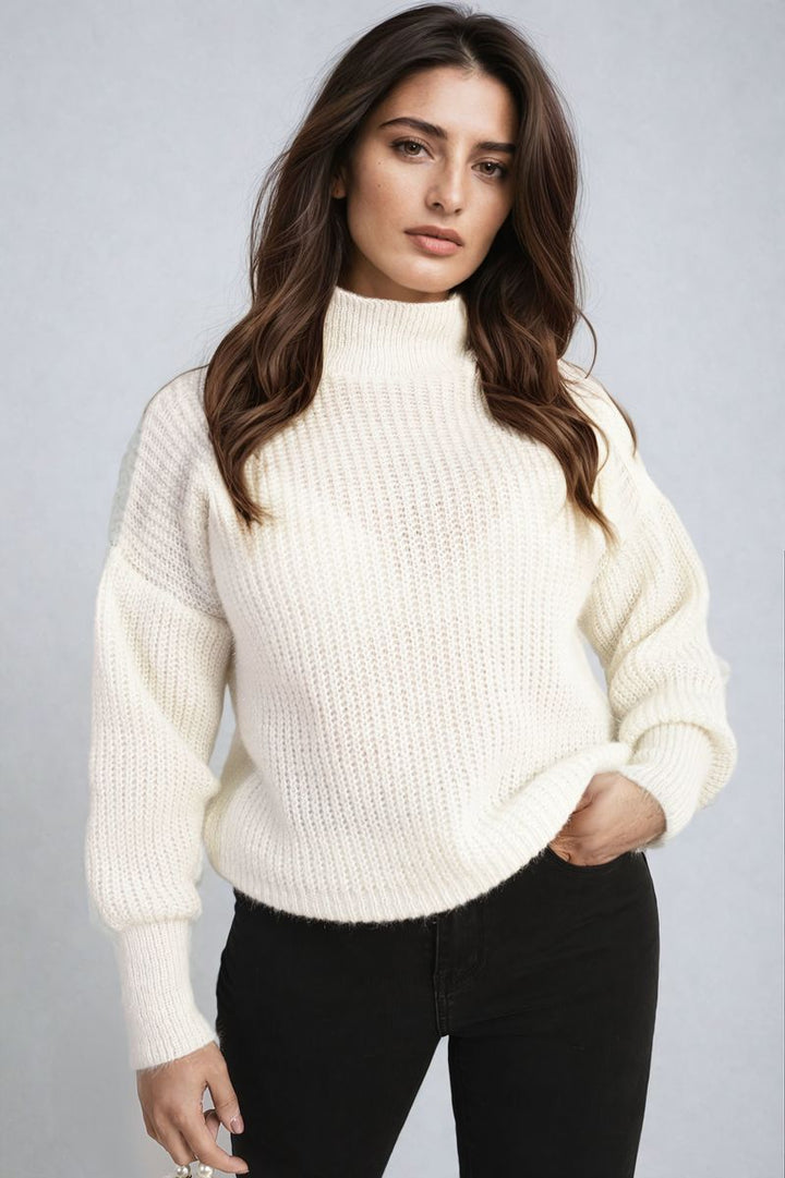 Woman wearing the Alejandra Buttons Long Sleeves Chunky Knit Top, showcasing its cozy chunky knit texture and stylish button details, ideal for layering and staying chic.