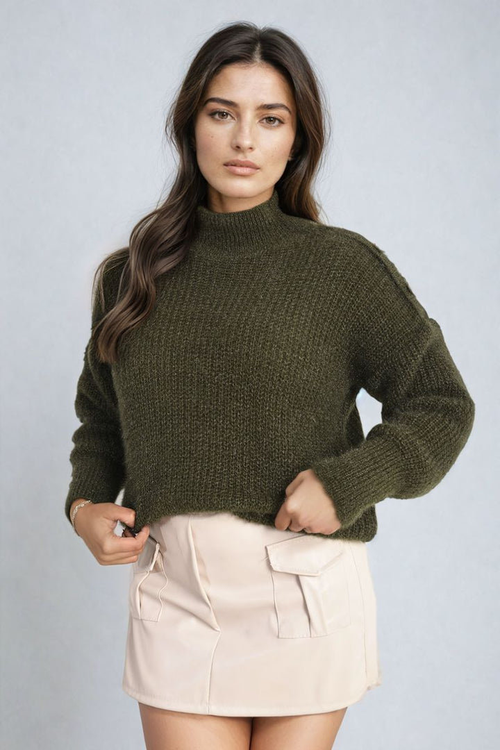 Woman wearing the Alejandra Buttons Long Sleeves Chunky Knit Top, showcasing its cozy texture and button details, ideal for stylish layering.