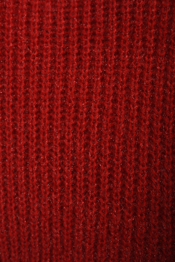 Close-up of the chunky knit texture of the Alejandra Buttons Long Sleeves Chunky Knit Top, highlighting its cozy and stylish design.