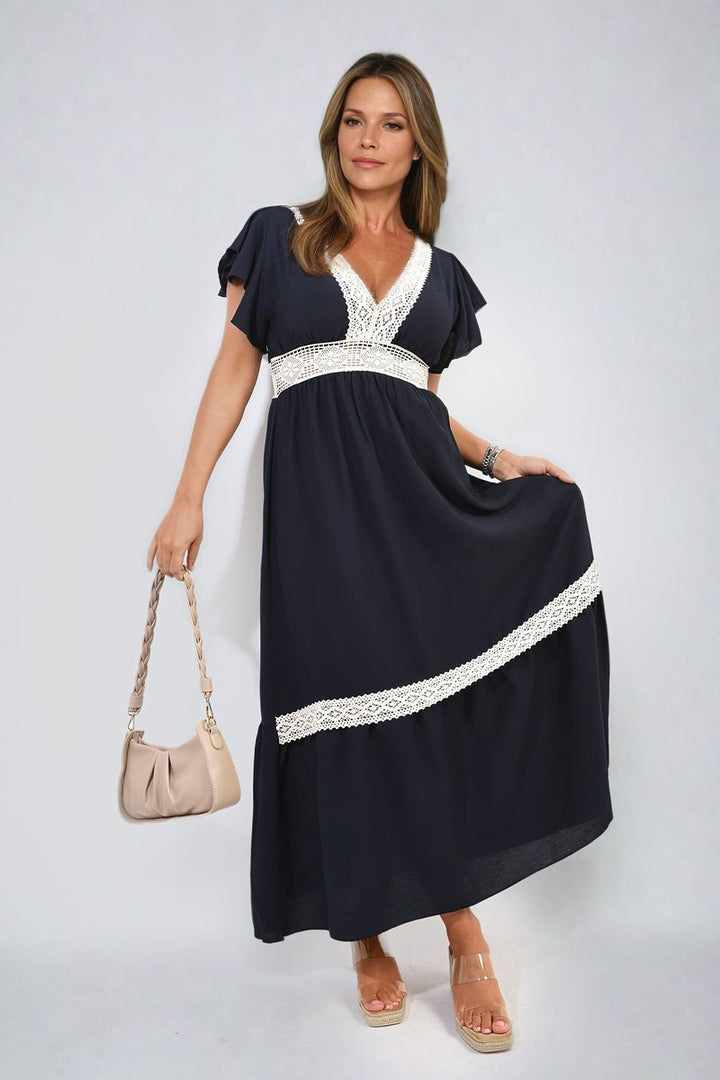 V-neck Lace Trim Maxi Dress on woman, showcasing elegant design with lace detail and flowing skirt, ideal for sophisticated events. Perfect holiday or everyday fashion choice.