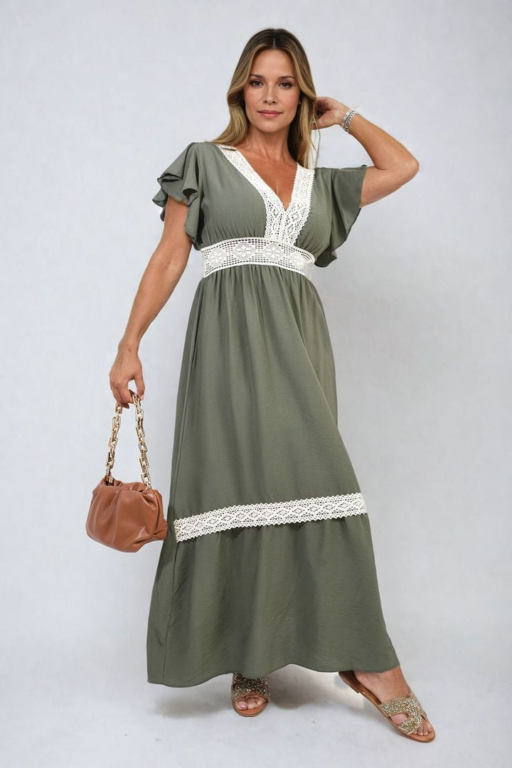 V-neck Lace Trim Maxi Dress elegantly draped on a woman, paired with a brown purse and gold sandals, showcasing timeless elegance and modern sophistication.