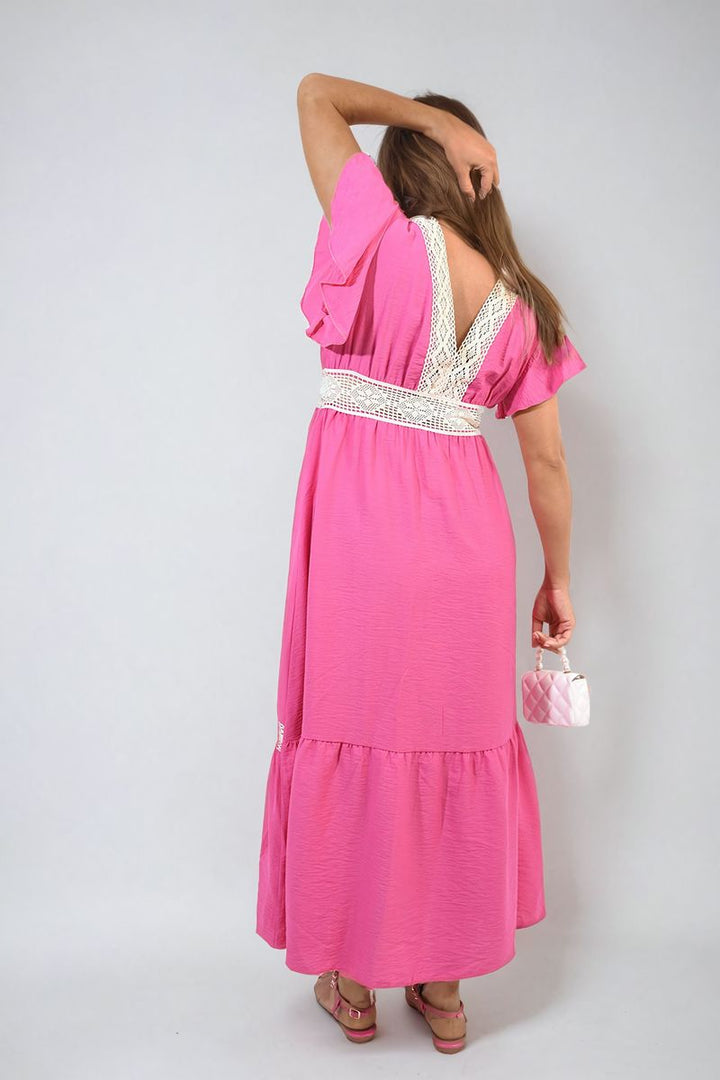 V-neck Lace Trim Maxi Dress worn by a woman, featuring a deep V-neckline and lace trim, ideal for elegant events.