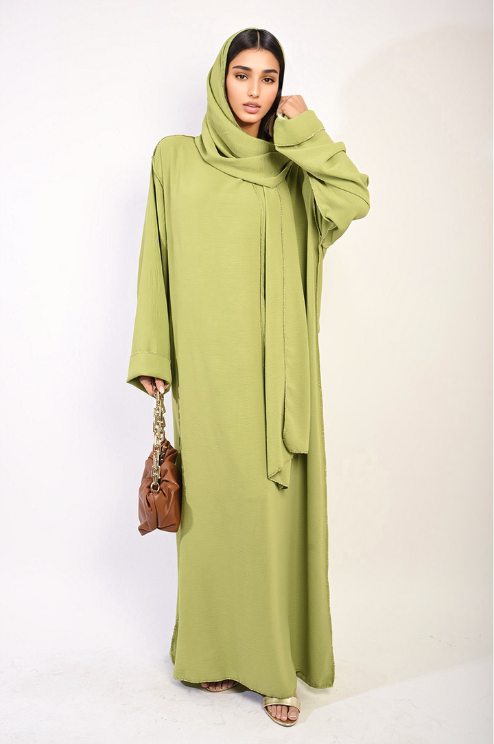 Woman in Long Sleeve Closed Abaya Maxi Dress with Embellished Piping, showcasing elegant style and modesty, suitable for various occasions. Scarf included.