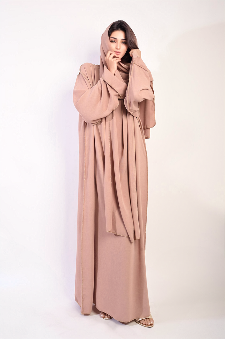 Woman wearing the Long Sleeve Closed Abaya Maxi Dress With Embellished Piping, featuring elegant long sleeves and a modest design, paired with a stylish headscarf.