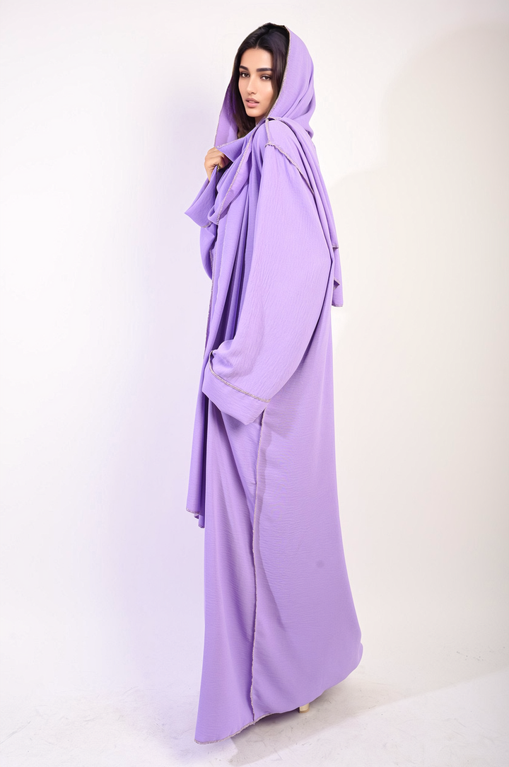 Woman wearing the Long Sleeve Closed Abaya Maxi Dress with Embellished Piping, showcasing its elegant design and modest style.