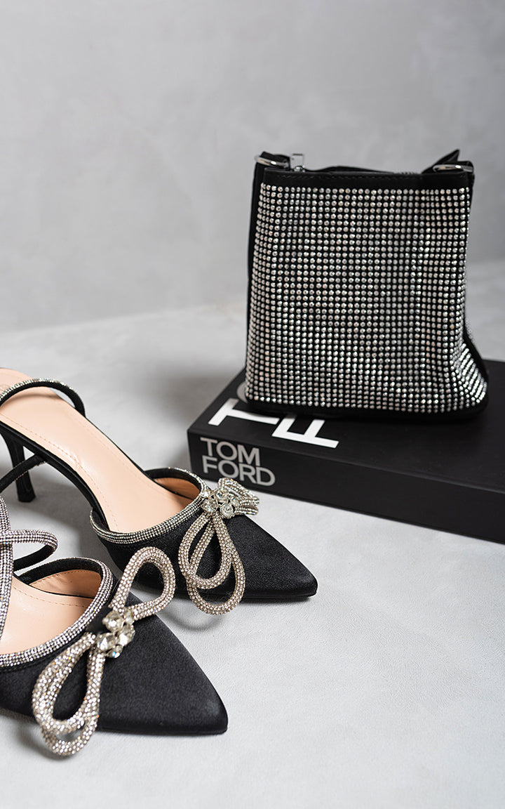 Mini Studded Rhinestone Shoulder Bag paired with black high-heeled shoes, featuring shimmering rhinestones, perfect for adding elegance and sparkle to any outfit.