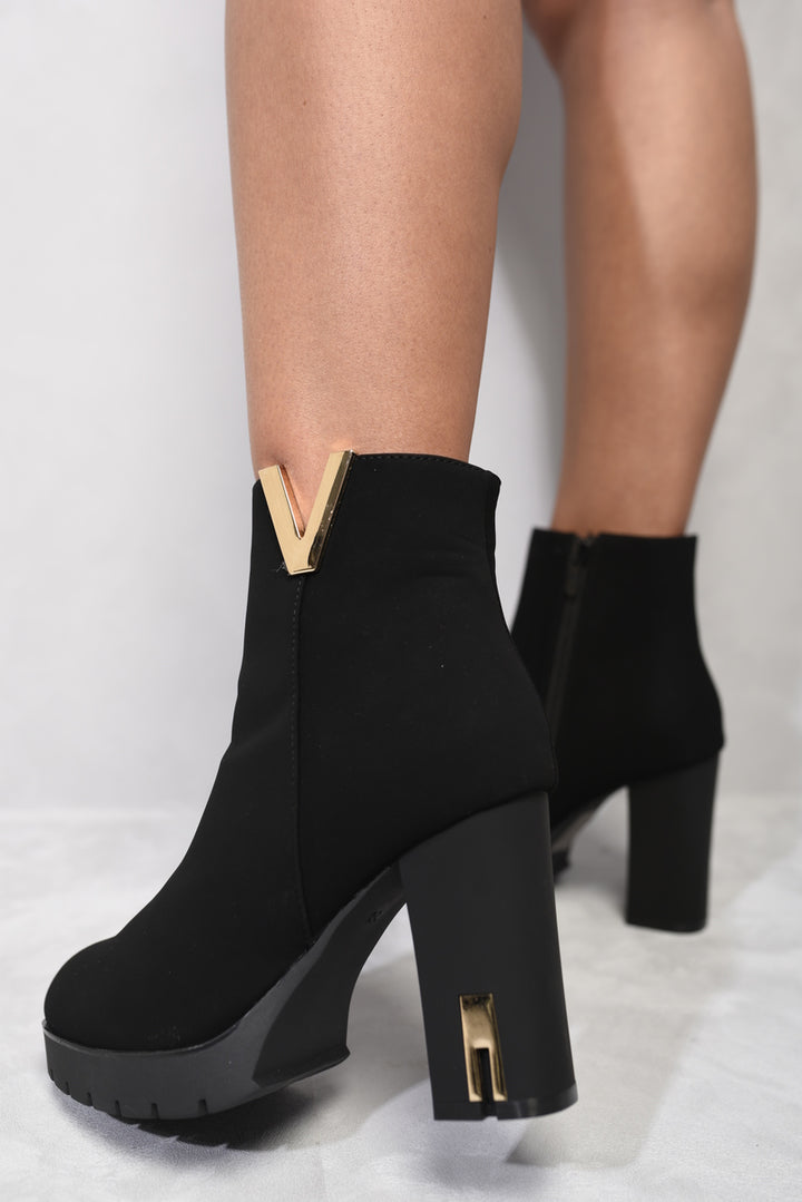 Heeled Ankle Boots with Gold Details, featuring a chic design and gold accents, perfect for stylish UK shoppers seeking comfort and elegance.