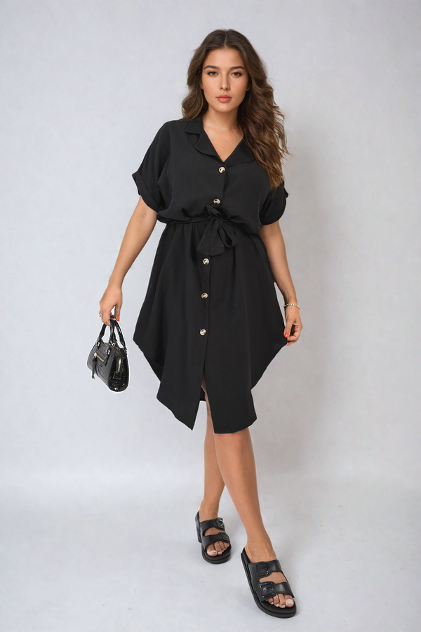 Woman wearing Allison Button Down Belted Mini Dress with black sandals, holding a black purse, showcasing a stylish summer outfit from Holiday Clothes UK.