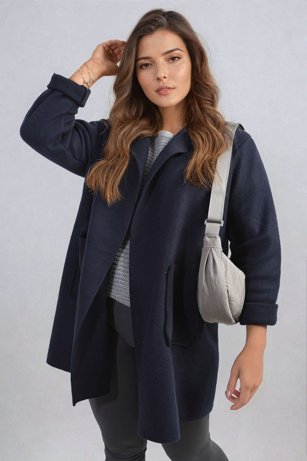 Woman wearing the Alma Open Front Folded Sleeve Jacket with Pockets, showcasing its stylish open front and folded sleeves, ideal for a chic, casual look.