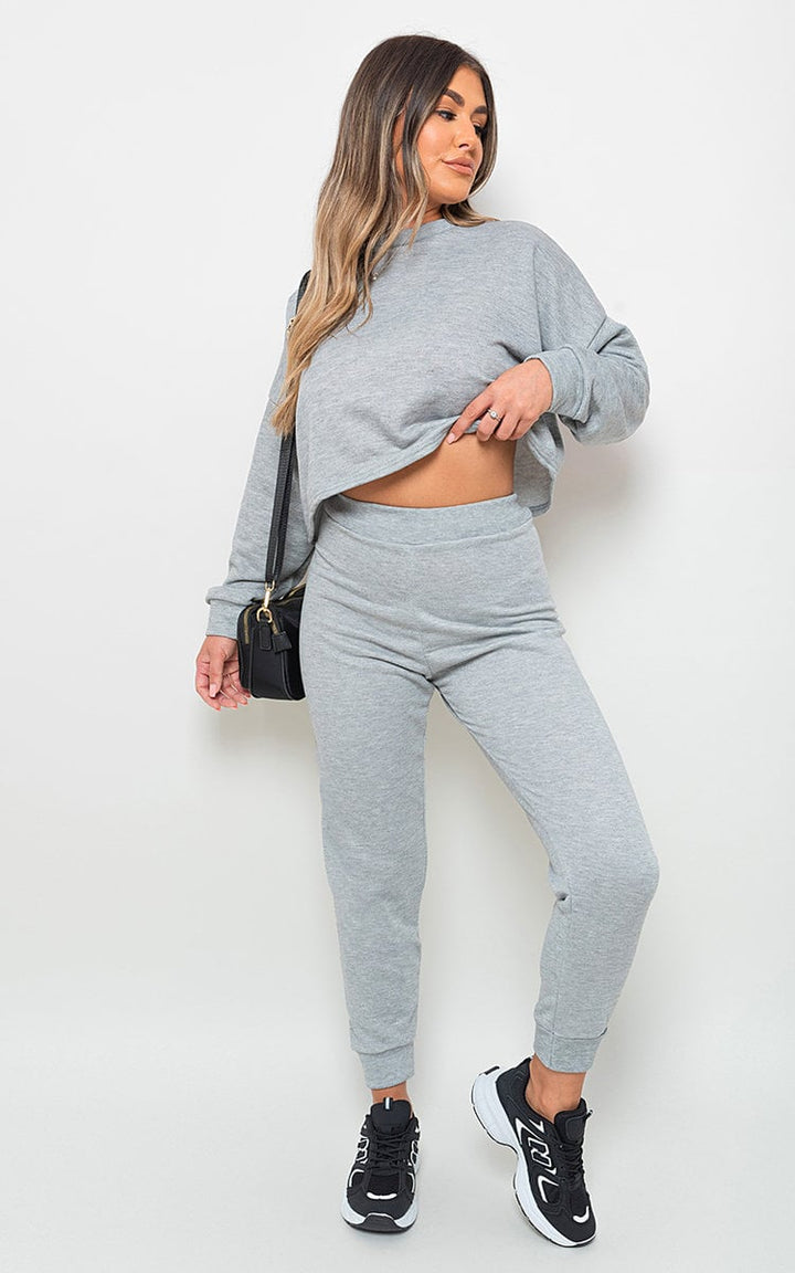 Woman wearing Amanda Sweatshirt and Jogger Loungewear Co-ord Set, showcasing stylish, relaxed fit with sneakers, embodying comfort and everyday elegance.