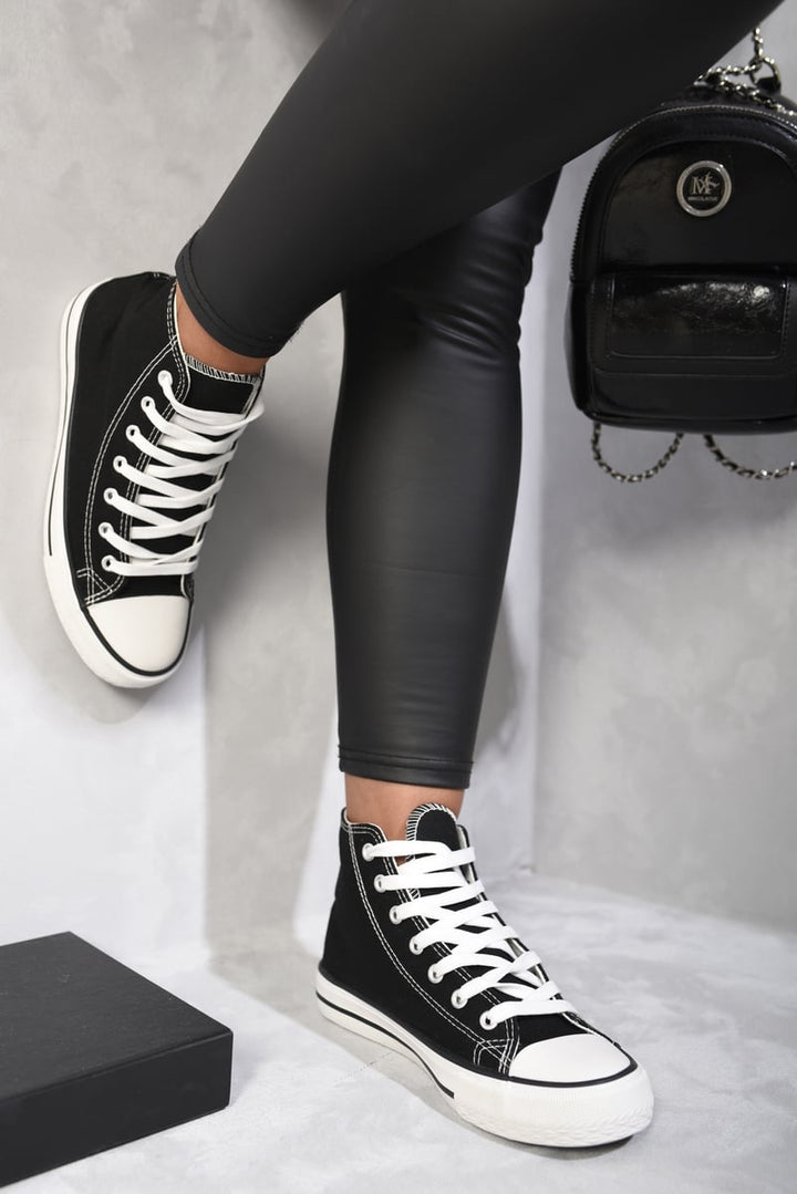 High Top Lace Up Trainers on a person's feet, showcasing sleek design and ankle support, perfect for stylish holiday and daily wear from Holiday Clothes UK.