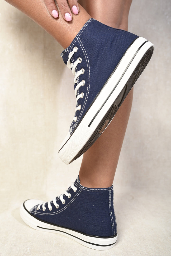 Andrea High Top Lace Up Trainers showcasing a sleek design with a durable canvas upper, emphasizing style and comfort. Perfect for dynamic lifestyles and everyday essentials.