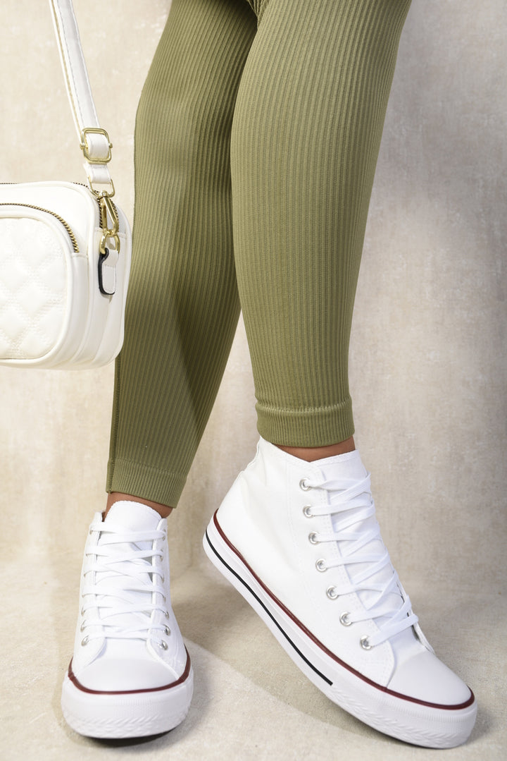 Andrea High Top Lace Up Trainers worn with green pants, showcasing sleek design and secure fit, ideal for stylish, everyday wear.