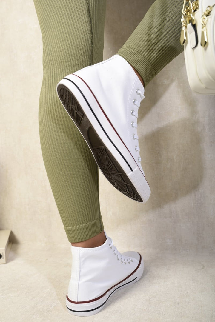 Andrea High Top Lace Up Trainers showcased on a model's feet, highlighting the sleek design and durable build, perfect for stylish and comfortable wear.