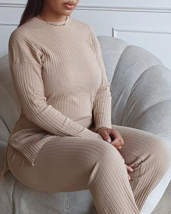 Woman in chair wearing Annalise Knitted Top and Trouser Co-ord Set, showcasing a comfortable, stylish outfit perfect for casual or smart-casual occasions.