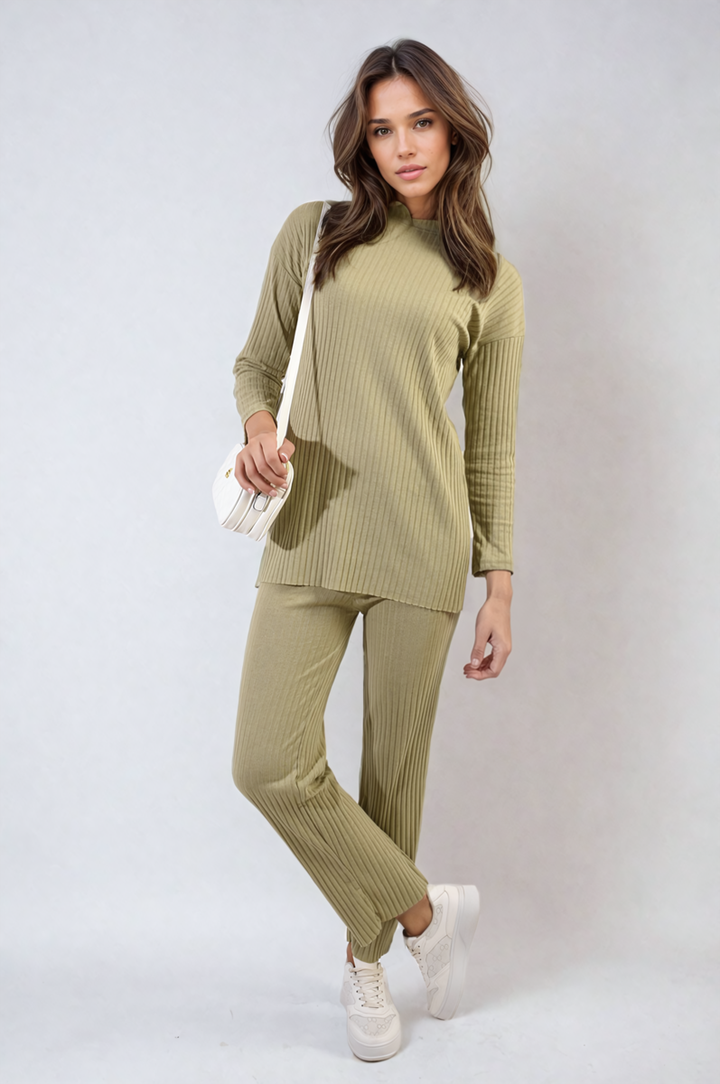 Woman in a knitted top and trouser co-ord set, showcasing a relaxed fit for stylish comfort and versatility. Ideal for casual outings or lounging.