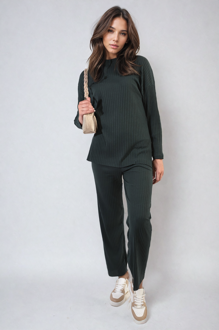 Woman wearing the Annalise Knitted Top and Trouser Co-ord Set, holding a purse and showcasing comfortable, stylish fashion from Holiday-clothes.co.uk.