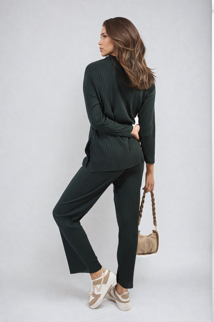 Woman in a black Knitted Top and Trouser Co-ord Set, hands behind her back, showcasing a stylish, comfortable outfit ideal for casual or smart-casual occasions.