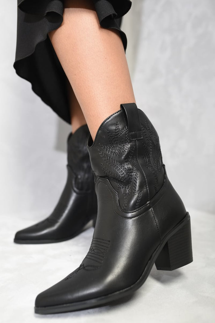 Mid Calf Zip Detail Cowboy Boots showcased with a stylish silhouette, highlighting modern mid-calf zip design for contemporary fashion enthusiasts.