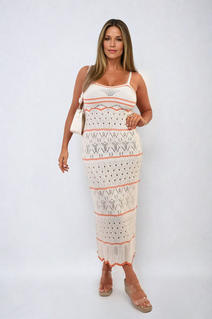 Strappy Long Knitted Stripe Cami Dress on a smiling woman, showcasing its elegant flowing silhouette and modern striped pattern. Perfect for stylish holiday occasions.