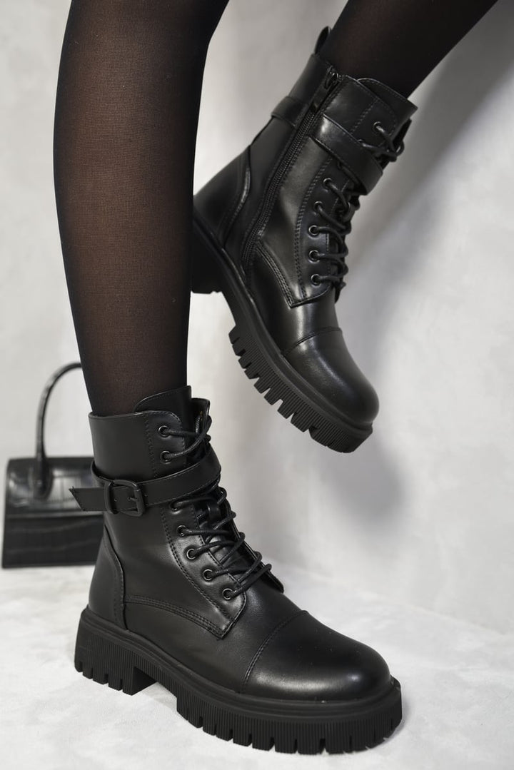 Lace Up Buckle Chunky Combat Boots showcasing edgy design with lace-up front and buckle detailing. Perfect for versatile styling, combining comfort and style for any occasion.