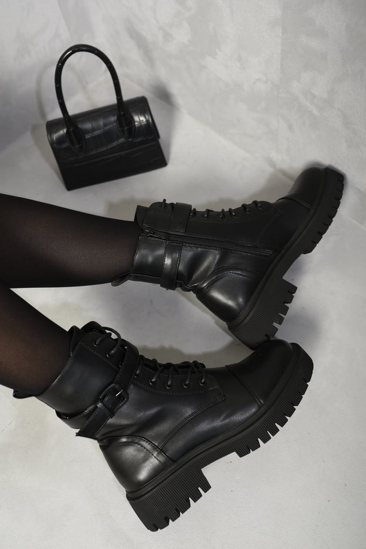 Lace Up Buckle Chunky Combat Boots with lace-up front and buckle details, showcasing a stylish and edgy design ideal for versatile everyday wear.