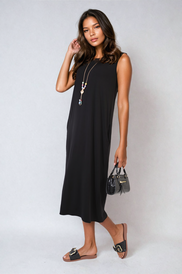 Sleeveless Slit Midi Dress with Side Pockets, worn by a model with a black purse and sandals, highlighting its chic, sleeveless design and practicality.