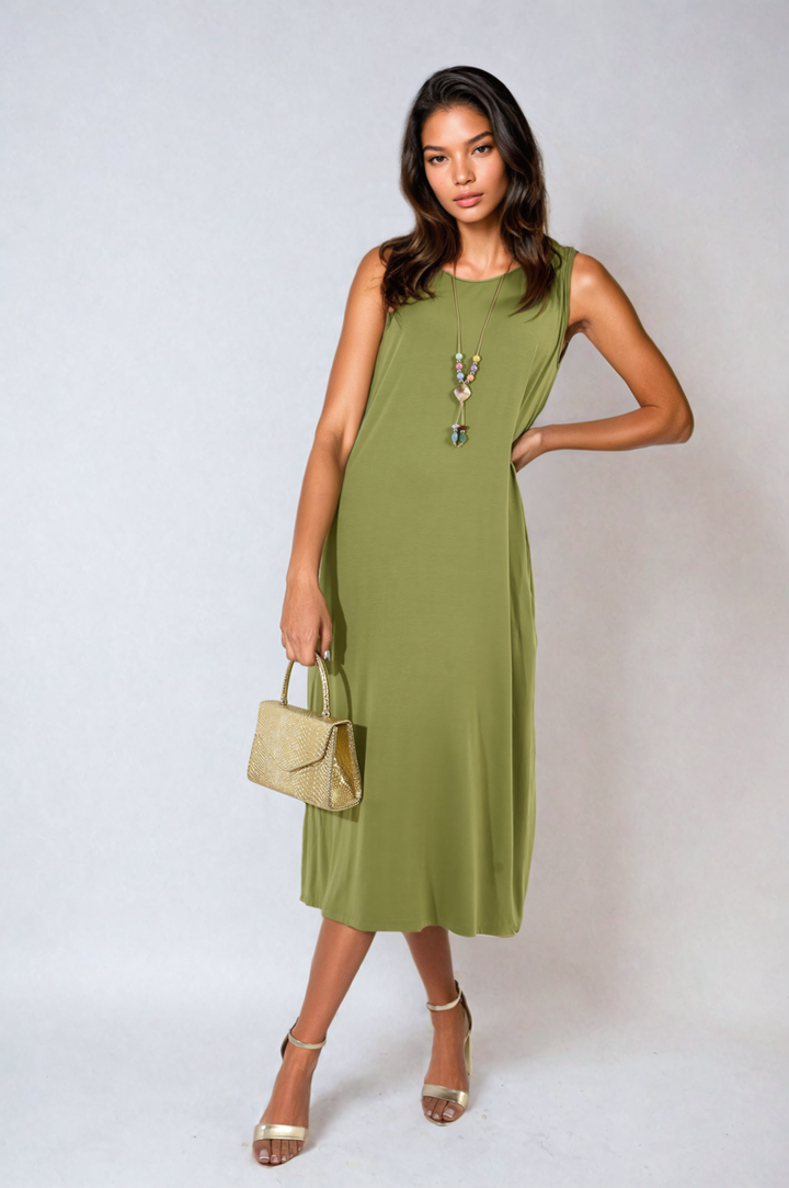 Woman wearing the Sleeveless Slit Midi Dress with Side Pockets, featuring a sleek design and stylish slit, ideal for chic, practical holiday wear.