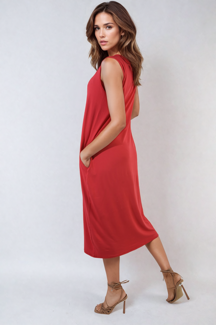 Woman wearing Sleeveless Slit Midi Dress with Side Pockets, showcasing its elegant design and practicality, ideal for stylish holiday or everyday wear.