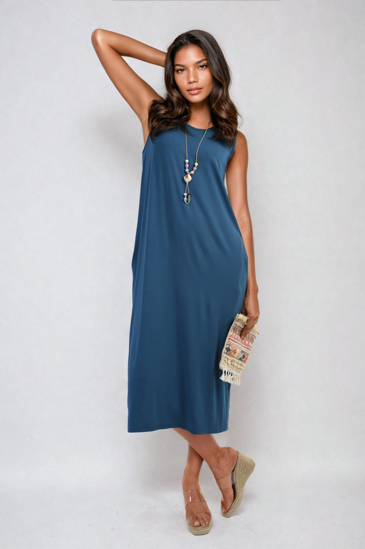 Woman wearing the Sleeveless Slit Midi Dress with Side Pockets, showcasing its elegant and practical design with a stylish slit and side pockets.