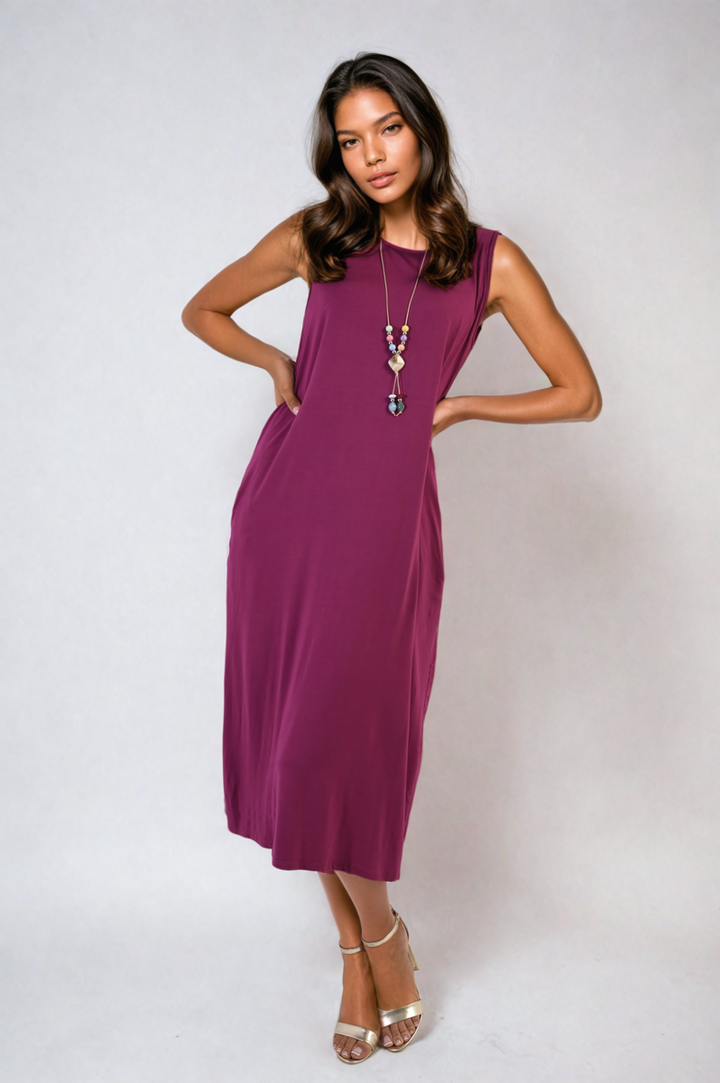 Sleeveless Slit Midi Dress with Side Pockets, showcased on a model, features a sleek design with a practical slit and side pockets.