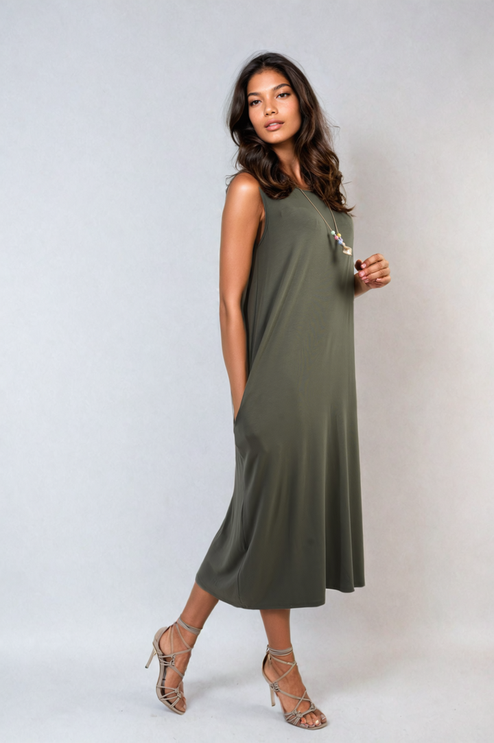 Woman wearing a Sleeveless Slit Midi Dress with Side Pockets, showcasing its elegant sleeveless design and practical slit, ideal for stylish holiday outings.