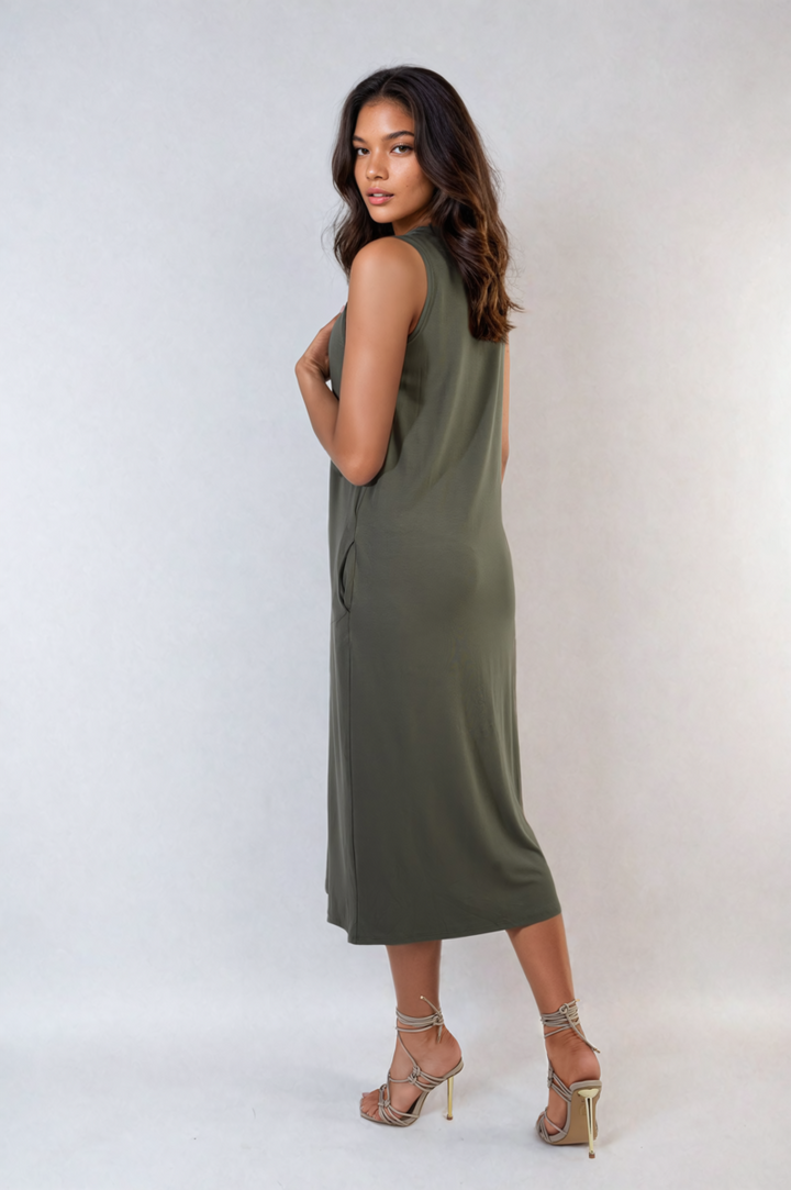 Sleeveless Slit Midi Dress with Side Pockets, modeled by a woman in high heels, showcasing its sleek, sleeveless design with a stylish slit and practical pockets.