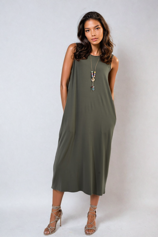 Sleeveless Slit Midi Dress with Side Pockets worn by a model, showcasing its elegant design with a slit and practical pockets, perfect for stylish occasions.