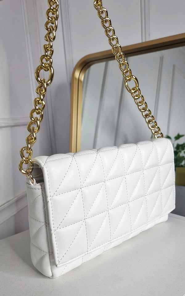 Faux Leather Padded Handbag with Chain Detail featuring a white quilted design and gold chain accents, perfect for stylish outings and special occasions.