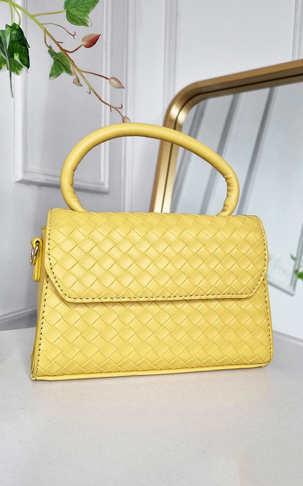 Faux Leather Quilted Handbag with a structured, stylish design, perfect for day-to-night wear, showcased on a white surface.