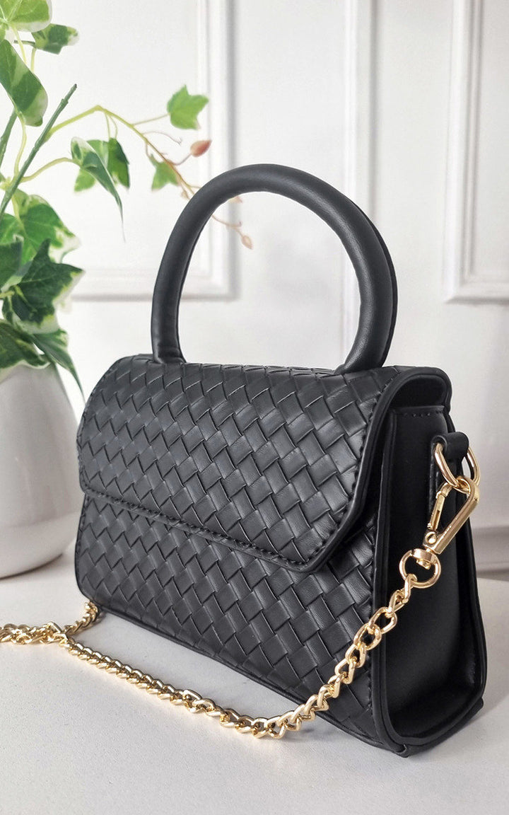 Faux Leather Quilted Handbag with gold chain and structured design, perfect for day-to-night wear, adding luxury and style to your outfit.